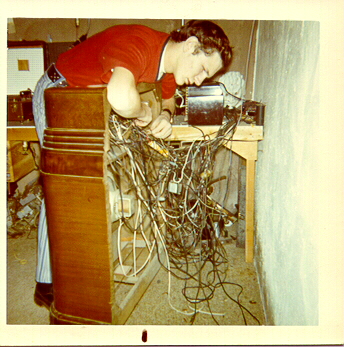 The SnowBoy looking over a tangle of wires in his home radio station in 1968.